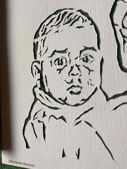 A super close-up look at the intricate details in the portrait for Liza Koshy. Every single line is carefully cut by hand to capture the unique features and expressions from the original photograph.