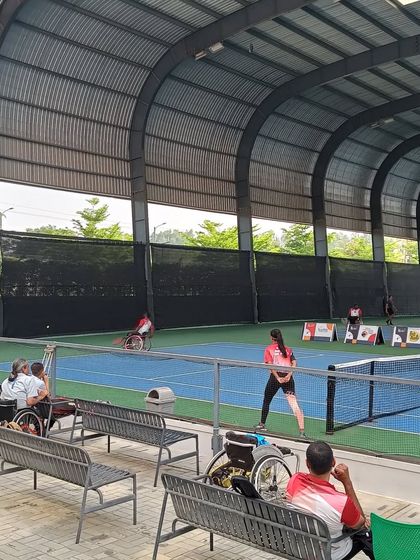 Spectators and players watch a match during the Tabebuia Open. Our facility is designed to be fully accessible and comfortable for athletes and fans alike.