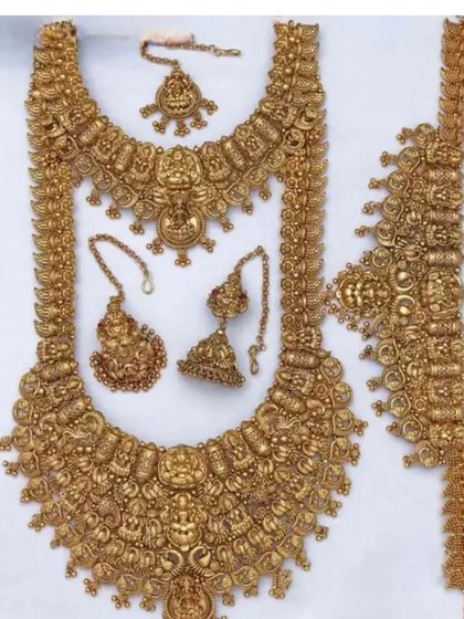 Another view of a complete temple jewellery set, showing the detailed craftsmanship of each piece.