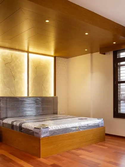 This view shows the warm wooden ceiling and flooring, which balance the clean lines of the design with a grounded, timeless finish.