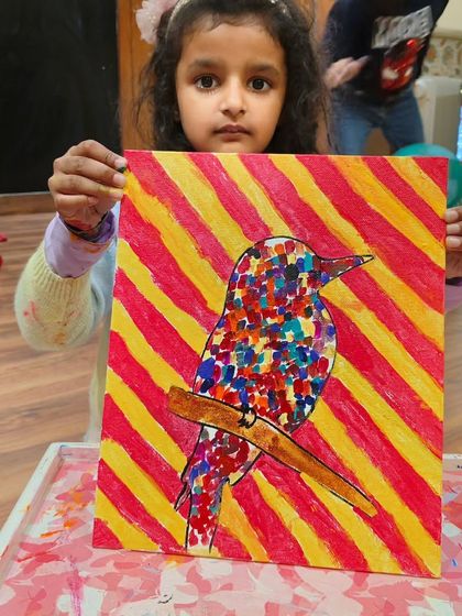 A vibrant take on our pointillism bird project, with a cheerful yellow and red background. The possibilities are endless.