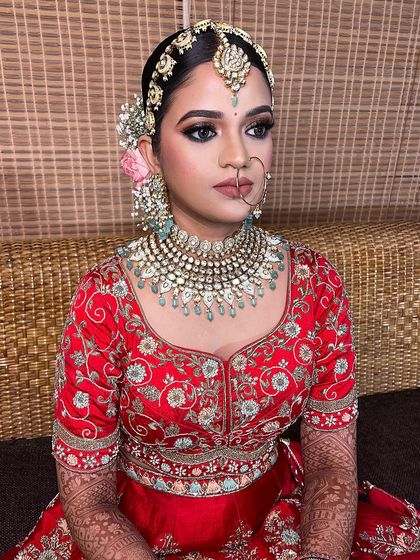 For this bride, I created a look with sultry smoked eyes, a pop of shimmer, and well-defined nude lips. The goal was to enhance her stunning features and create a balanced, beautiful bridal look.