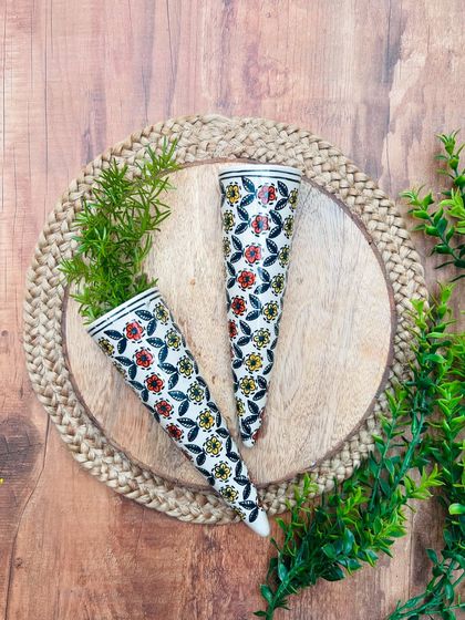 A close-up of our hand-painted ceramic conical wall planters. These are perfect for water plants and come in six different variants. Grab them now while our 'Buy 2 Get 2 Free' offer lasts.