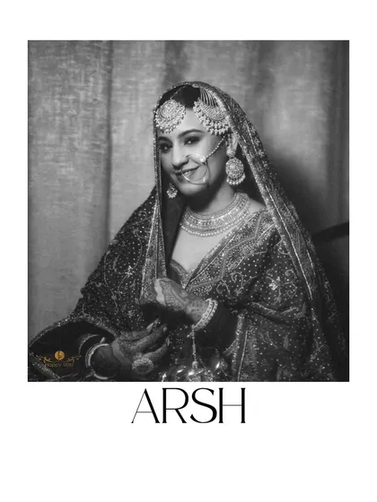 A classic, elegant black and white portrait of our Punjabi bride, Arsh. This timeless shot captures her grace and the traditional beauty of her wedding day look.
