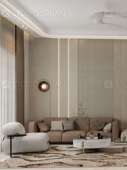 A lobby in a Model Town residence, featuring a comfortable, modern sofa and textured wall panels with integrated lighting for a soft, ambient glow.