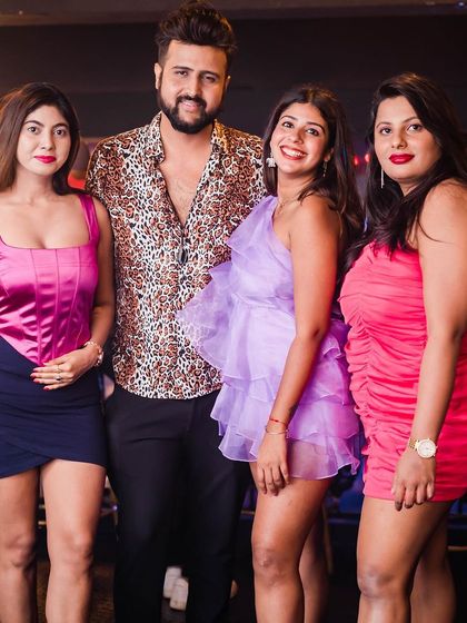 A group of friends posing for a photo.