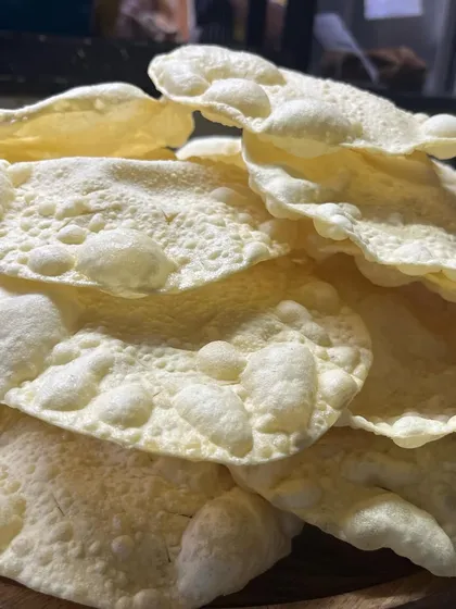 The humble Papadum, a hero from start to finish. Its satisfying crunch, when crushed over rice and curry, adds a wonderful texture and salty kick to every single morsel of the meal.