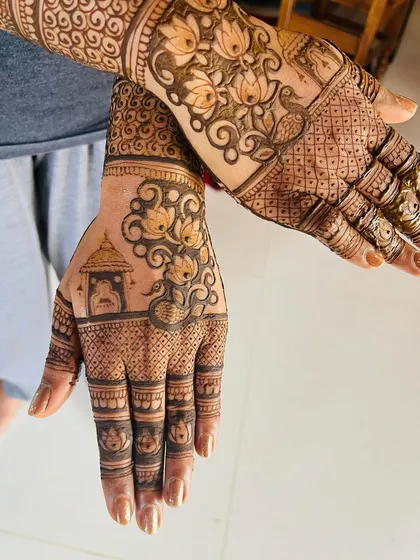 Here is a full view of a detailed design combining several elements. You can see a temple motif, lotus flowers, and peacock-inspired swirls, all tied together with intricate filler patterns.