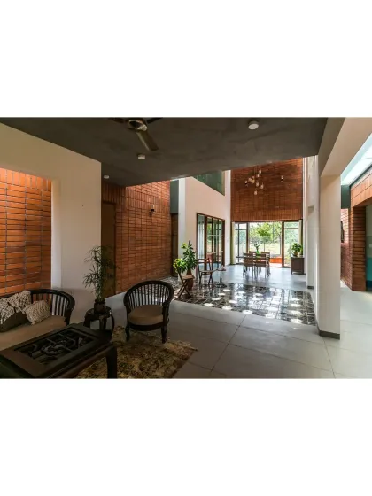 This space from 'An Earthy Affair' showcases my love for an honest material palette. The exposed brick walls provide a warm, textured backdrop to the open-plan living area, creating a home that feels grounded and authentic.
