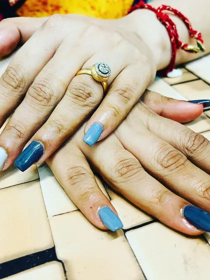 A cool-toned set inspired by Sonakshi Sinha, featuring a mix of grey, blue, white, and black nails.