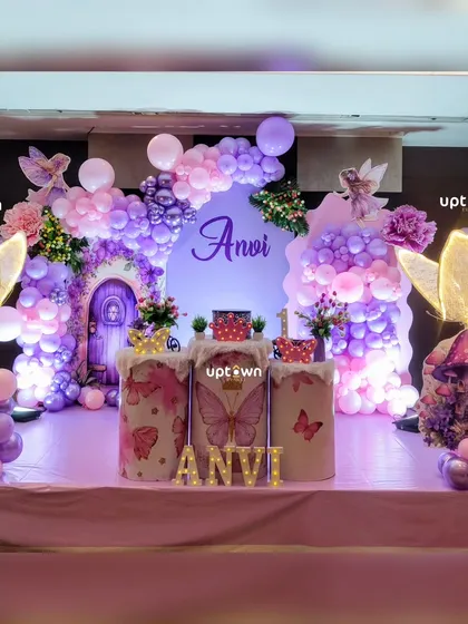 We bring magical themes to life with detailed decorations. This fairy and butterfly party features a stunning balloon arrangement in shades of purple and pink, custom-lit butterfly wing's, and themed plinths for the cake and dessert's, creating an enchanting world for the birthday girl.
