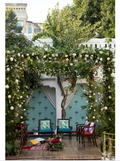 For this intimate wedding ceremony, we created a beautiful backdrop inspired by the couple's love for poetry, with a floral arch framing a serene seating area.
