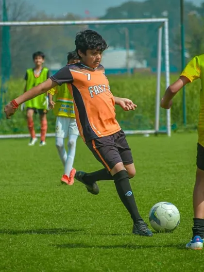 A U13 player taking a shot on goal during the Pride Cup in Gurgaon.