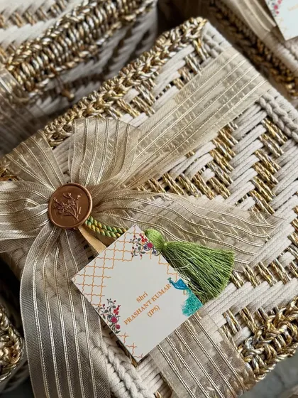 It was an honor to design these engagement invitation hampers for cricketer Rinku Singh and MP Priya Saroj. Each bespoke woven box was finished with a personalized gift tag and our signature wax seal, reflecting the opulence and importance of this special union.