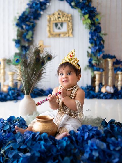 This little Krishna is ready with his flute and pot of butter.