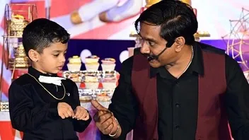 Magic is for everyone. Here, I am sharing a special moment with a young volunteer on stage during a birthday party performance. Making a child feel like a star is one of the best parts of my job.