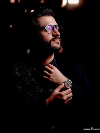 A stylish, low-key portrait of the groom. I make sure to capture stunning individual shots that reflect your personality and style on the big day.