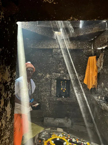 A priest inside the restored Wageshwar Temple, illuminated by a shaft of sunlight. This project was a careful intervention to stabilize the ancient structure while enhancing its spiritual atmosphere through the deliberate manipulation of light.