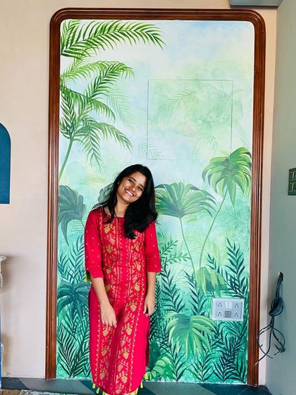 We call this our tropical paradise. We transformed the walls of a restaurant with a misty forest theme, covering even the doors to create a seamless, immersive jungle experience with colorful birds and lush greenery.