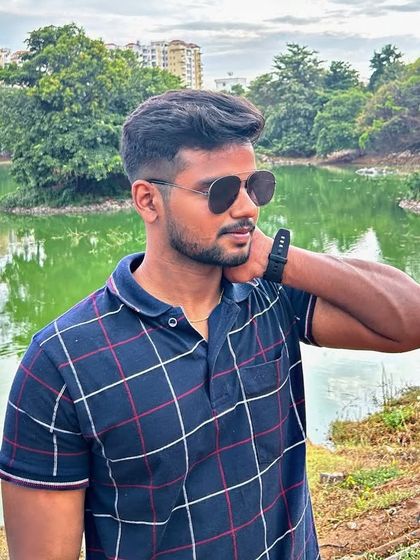 A portrait by the lake with the city's apartment buildings visible in the background, showing the mix of nature and urban life.