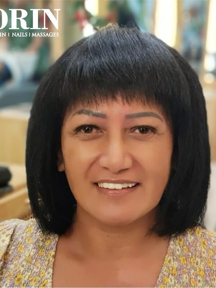 A classic bob with a fringe. This haircut is timeless, chic, and frames the face beautifully.