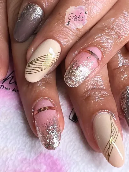An elegant and modern design with a mix of nude, pink, and grey, accented with glitter and fine gold lines.