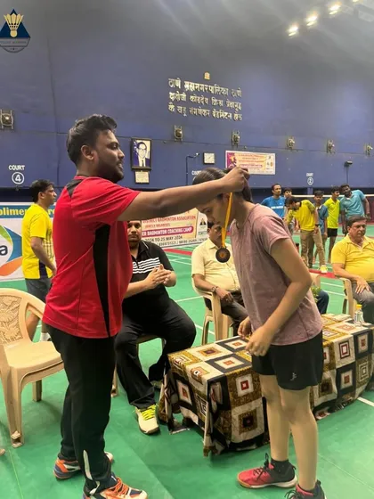 A moment of recognition during the Summer Camp 2024, where a player is awarded a medal for her performance.