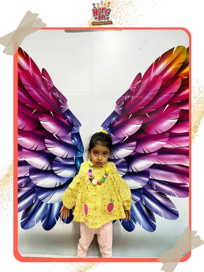 A little angel spreading her wings. This photo captures the sweet and playful side of our academy, where every child gets to shine.