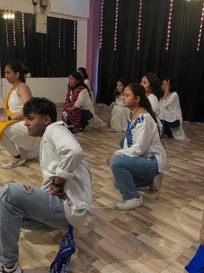 Students learning the choreography for our Holi special. Everyone is dressed in white, ready for the colors.
