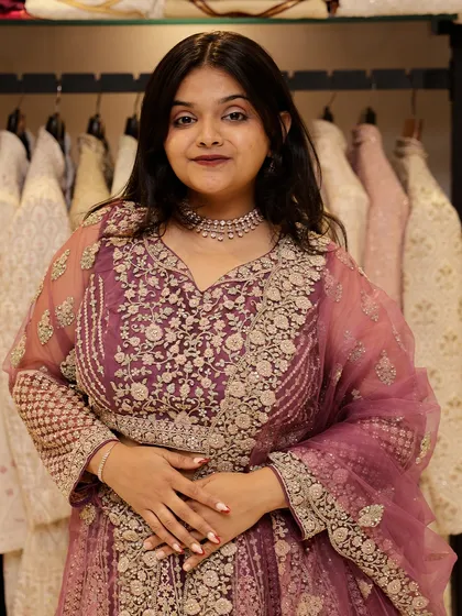 A closer look at the delicate net and embroidery of this pink lehenga, perfect for a romantic and feminine vibe.