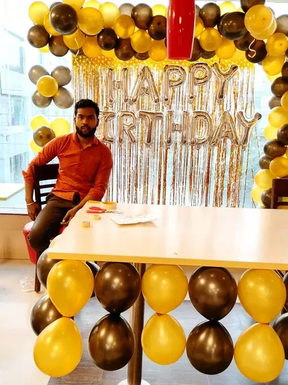 Taking a short break after setting up a birthday decoration at a cafe. We're proud of our work and always make sure everything is perfect for our clients.