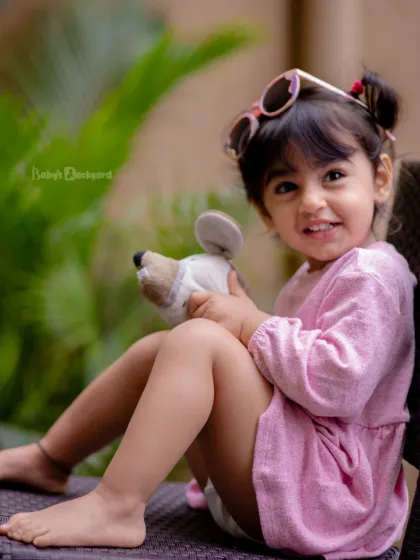 Sunshine mixed with a little bit of sparkle. This little fashionista is ready for her close-up.