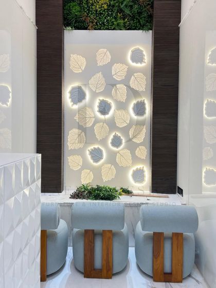 Another view of the custom-designed mandir, highlighting the soft glow from the backlit panel and the lush greenery above, which adds a touch of natural tranquility to the sacred space.