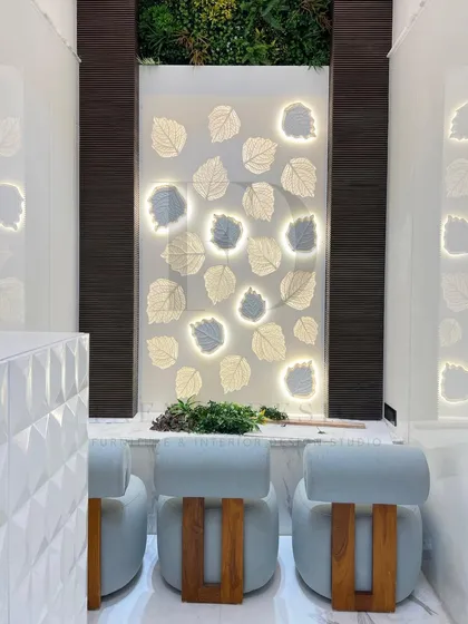 This shows custom-designed low seating for a serene home mandir. The chairs, upholstered in a light blue fabric with solid wood bases, are crafted to be both beautiful and appropriate for a sacred space.