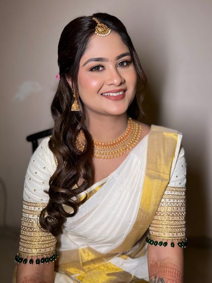 A beautiful, happy portrait of my South Indian bride. The makeup is fresh and radiant, highlighting her smile and the elegance of her look.