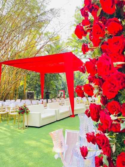 A view of the guest seating, showing how the vibrant red theme was carried through the entire ceremony space.