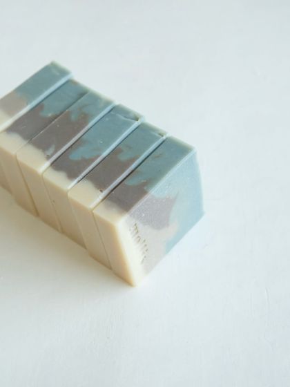 A stack of 'Rain Veil' bars, ready to bring a moment of calm to your daily ritual.