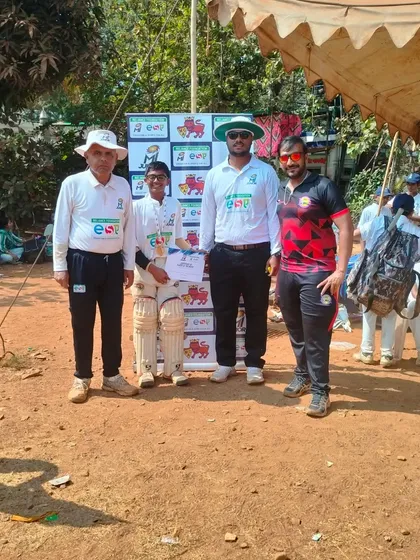 Parth Rane with his 'Man of the Match' award, supported by his teammates and officials during the MI Junior U-14 tournament.