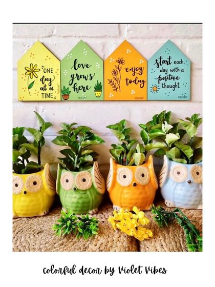 Shop colors, shop quotes, shop handmade. This image shows our colorful ceramic owl planters paired with our wooden huts, a perfect combination for creating a happy and green corner in your home.