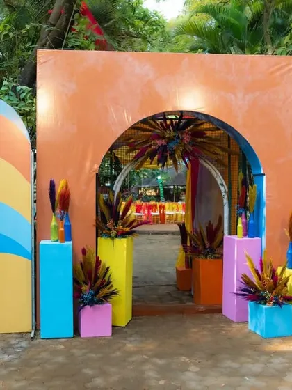 Another view of the colorful carnival entrance, showcasing the layered arches and playful decor elements that welcomed guests to the party.