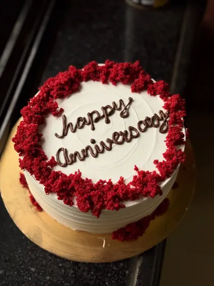 A classic Red Velvet cake for an anniversary. The rich red cake crumbs around the border add texture and a pop of color.