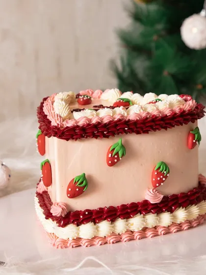 Another angle of the lovely strawberry heart cake, perfect for a cozy Christmas celebration.
