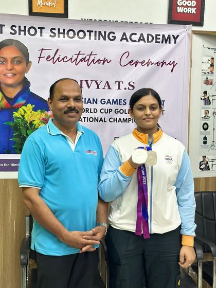 Divya T.S. with me, showcasing her two silver medals from the Asian Games.