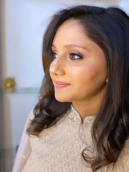 The glow is real. This client look features a beautiful purple smokey eye and luminous skin, creating a glamorous yet sophisticated appearance for a wedding event.