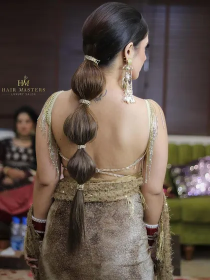A back view of a chic and modern bubble ponytail, a stylish choice for any festive occasion.