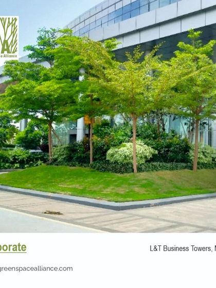 The landscape for the L&T Business Towers in Mumbai features clean lines, manicured lawns, and strategically placed trees. This corporate campus design projects a professional and modern image while providing green breakout spaces for employees.