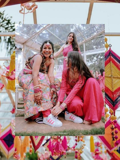 A fun and quirky shot of the bride Arya getting help with her sneakers from her bridesmaids. It's a reminder that weddings are also about comfort and fun.