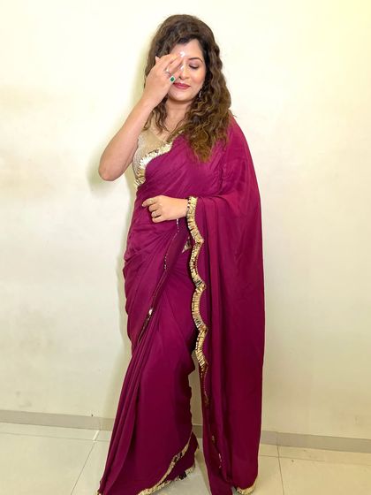 A candid and shy moment captured. The makeup is soft and natural, perfect for a casual and elegant look.