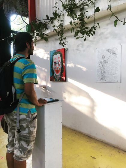 This portrait of Charlie Chaplin is made entirely of Morse code, spelling out his quote: "I always like walking in the rain, so no one can see me crying." It sheds light on the coded ways people often ask for help, inviting viewers to decode the message and reflect on the importance of listening closely.