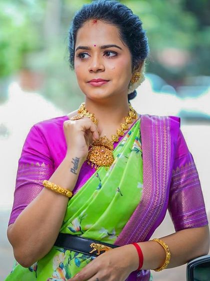 A close-up of Poojitha's modern-traditional look, showing how to style a classic saree with a contemporary edge.